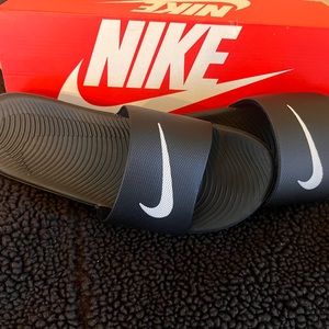 Brand new Nike slides. Unisex. Size 8